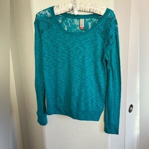 No Boundaries Teal Long Sleeve Top with Lace Detail on shoulders and backside.